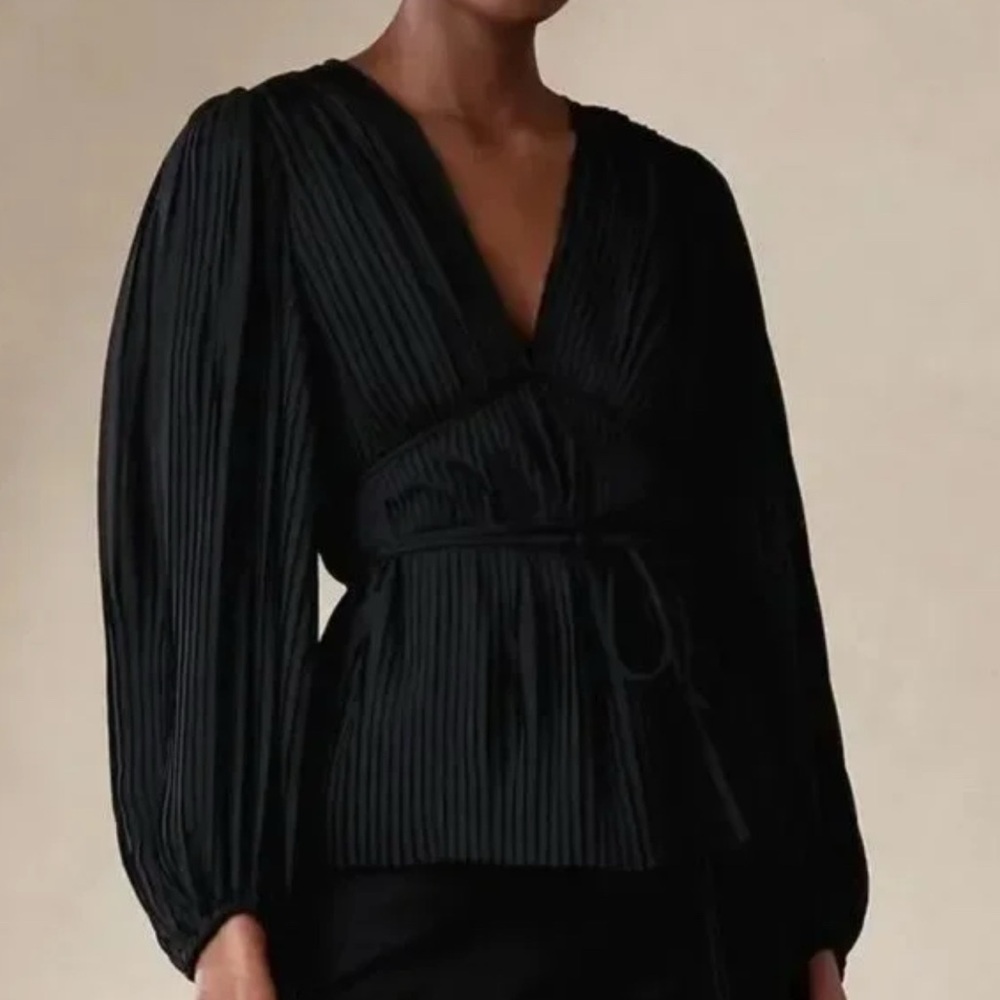 Black, pleated, flowing blouse with v-neck by Banana Republic.